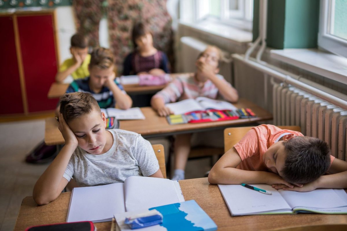 A group of tired students in class.